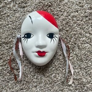 Red and White Decorative Mask with Ribbons